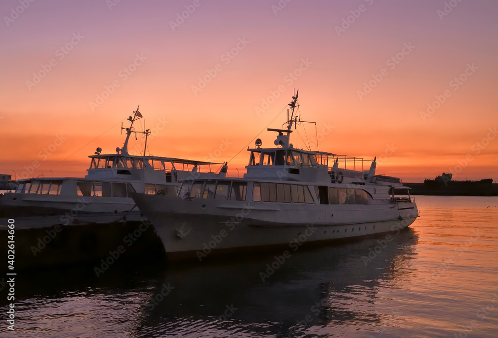 Pleasure boats at the pier in Yalta in the early morning Pleasure boats at the pier in Yalta in the early morning