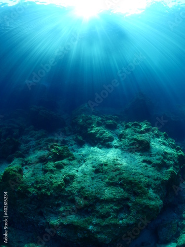 sun ray and sun beam scenery underwater waves on surface of water slow ocean scenery © underocean