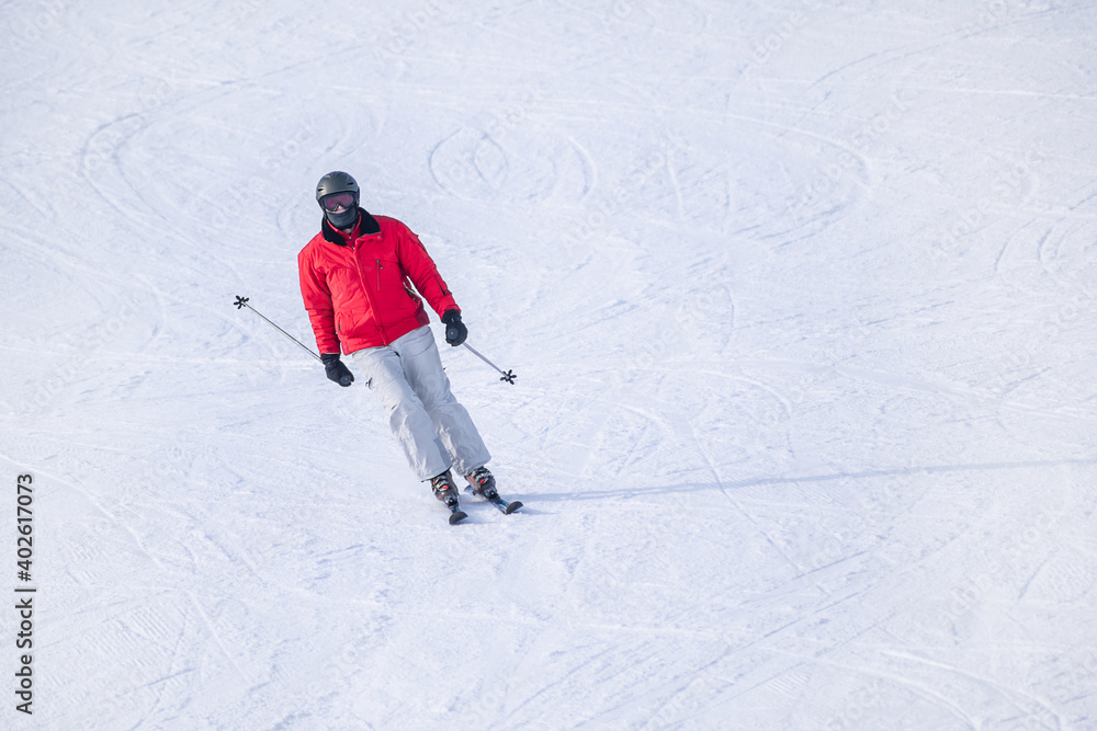 People are having fun in downhill skiing and snowboarding	