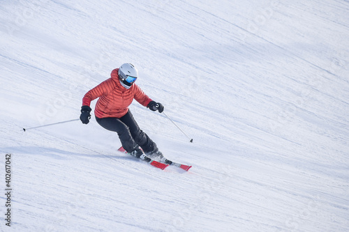 People are having fun in downhill skiing and snowboarding 