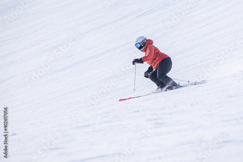 People are having fun in downhill skiing and snowboarding 