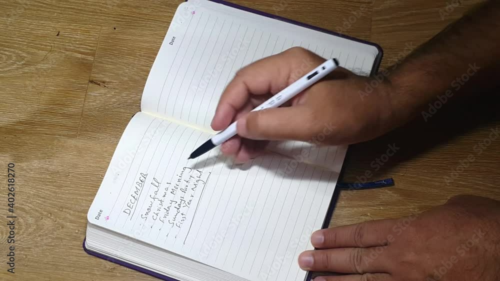 closeup view of writing important notes in a diary closeup view of writing important notes in a diary