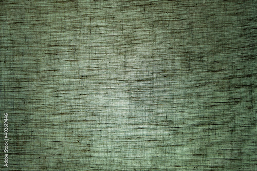 abstract rough colored linen natural fabric background, toning, short focus