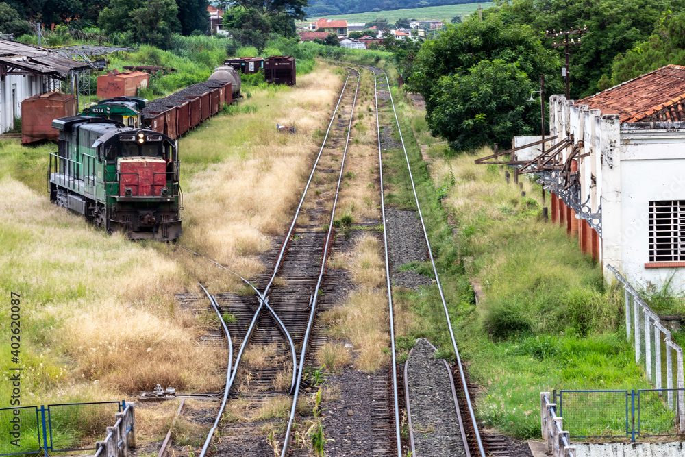 Naklejka premium Locomotives and wagons abandoned in the maneuvering yard of the Matão Railway Station, in Matao city, Sao Paulo state, Brazil