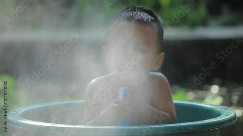 asia; asian; baby; basin icon; beauty; blonde; boy; child; foggy; fun; game; hand; happy; kid; little; people; preschoolers; smile; splash; splashing; spray; summer; thai; thailand; traditional; water