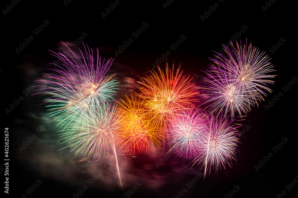 celebration happy new year and merry christmas funcy colorful firework on isolated black background