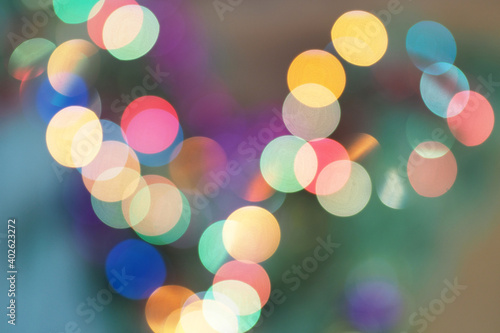 Multicolored blurred holiday lights. Background for wallpaper. Pattern.