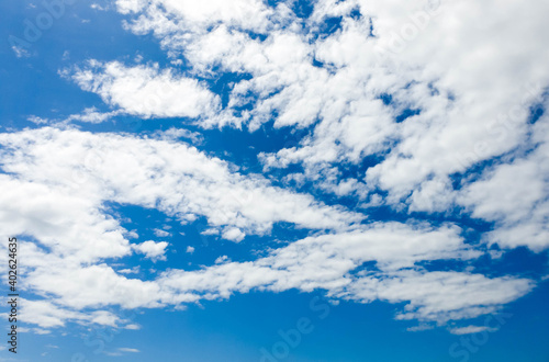 Bright blue sky background and white clouds