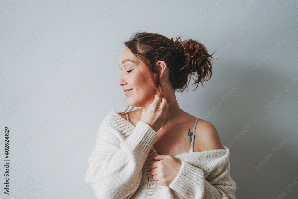 Attractive sensual smiling brunette woman middle age at home cozy vibes cold season Attractive sensual smiling brunette woman middle age at home cozy vibes cold season