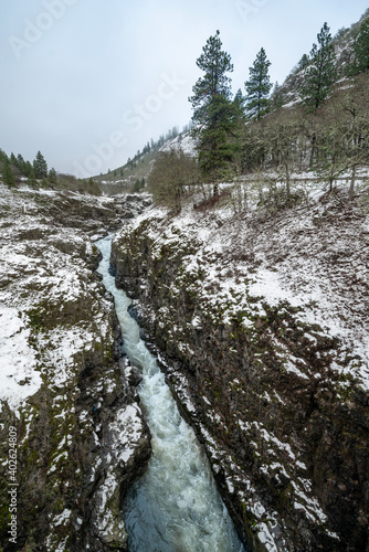 Swale Canyon along the Klickitat River surrounded by snow during the winter season. Lewis and clark called it Cataract River due to the rapids on this wild and scenic river. A Columbia tributary.  photo