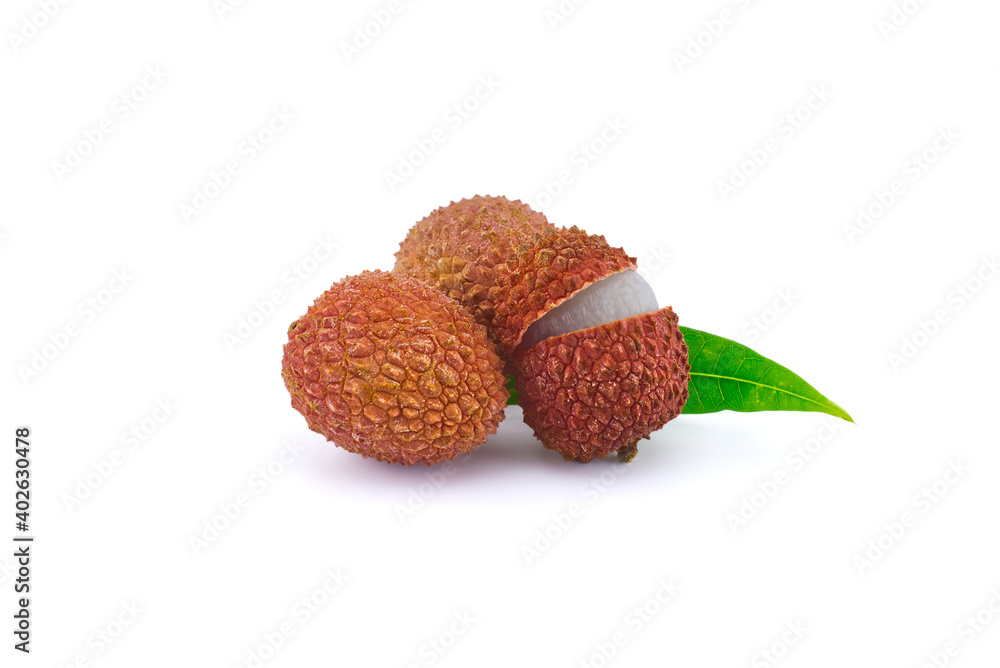 Lychee fruit whole and opened with green leaves Lychee fruit whole and opened with green leaves