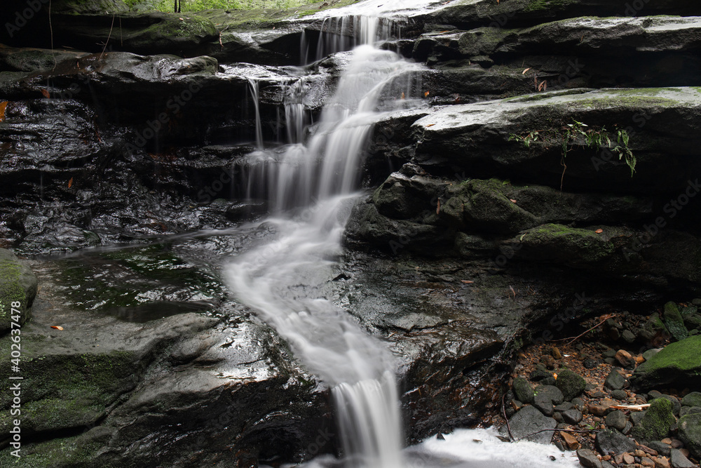Fototapeta premium Flow of water on the rocky cascade.