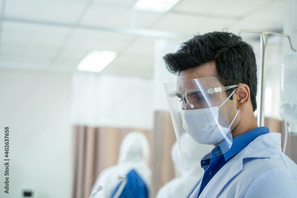 Close up medical doctor wearing face shield at hospital,Coronavirus Disease 2019 (COVID-19),Coronavirus has turned into a global emergency. Close up medical doctor wearing face shield at hospital,Coronavirus Disease 2019 (COVID-19),Coronavirus has turned into a global emergency.