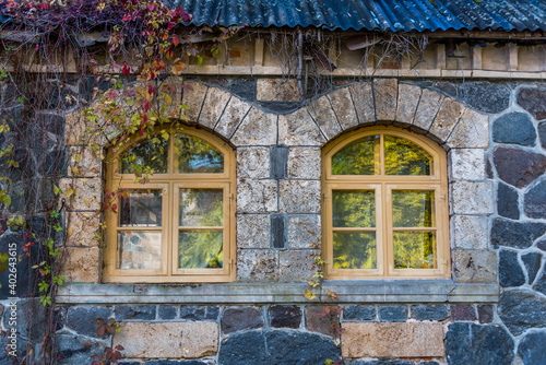 Ancient Windows in an old Stone Building in Autumn
