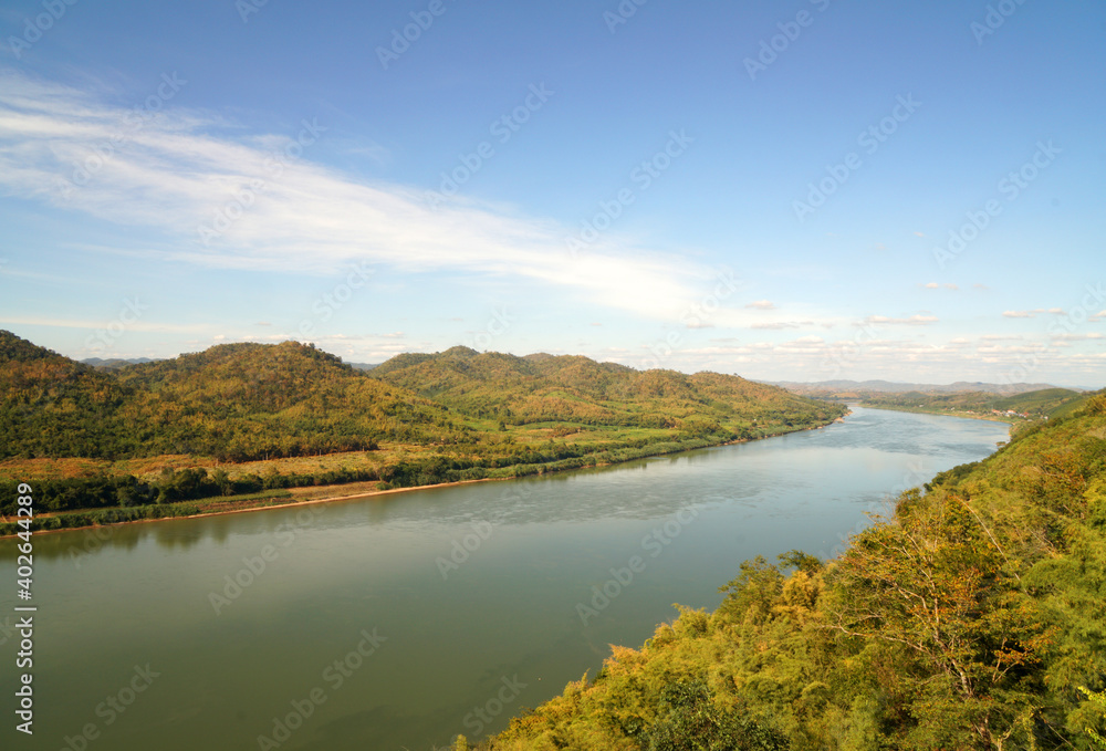 Aerial view of Landscape Maekhong river separates the border between Thailand and Laos in sunny day blue sky and green mountain from Prayai Phu Kogngew temple at chiang khan loei thailand - travel 