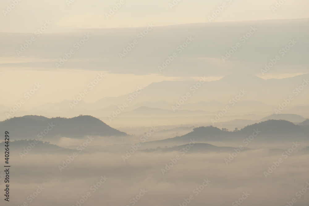 Landscape mountain with fog in the morning at Phu thok at chiang khan loei thailand - soft white nature scene abstract 