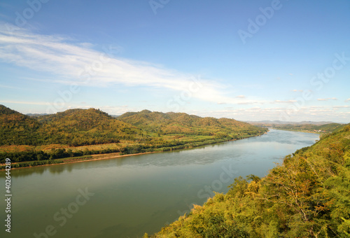 Aerial view of Landscape Maekhong river separates the border between Thailand and Laos in sunny day blue sky and green mountain from Prayai Phu Kogngew temple at chiang khan loei thailand - travel 