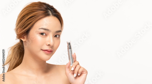 Beauty asian woman hold bottle cosmetic cream lotion and cheerful.