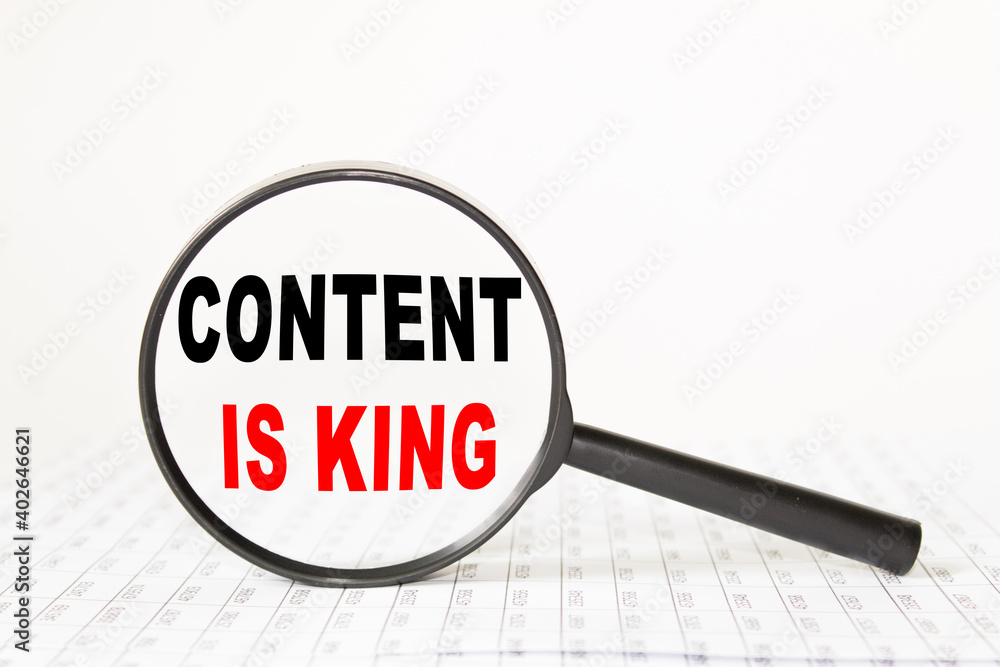 words CONTENT IS KING in a magnifying glass on a white background. business concept words CONTENT IS KING in a magnifying glass on a white background. business concept