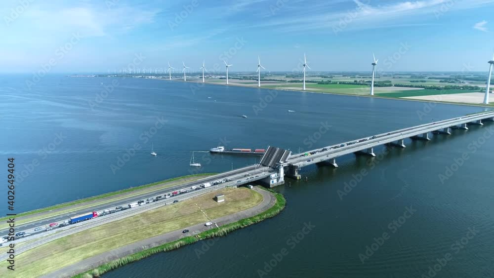 custom made wallpaper toronto digitalCargo Ship Going Under a Bridge between the IJssel Lake and Ketel Lake - Flevoland, The Netherlands, 4K Drone Footage