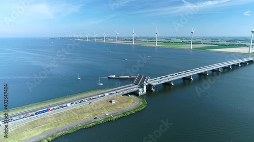 Wallpaper Mural Cargo Ship Going Under a Bridge between the IJssel Lake and Ketel Lake - Flevoland, The Netherlands, 4K Drone Footage Torontodigital.ca