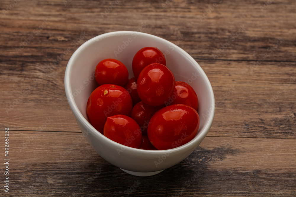 Pickled cherry tomatoes in the bowl Pickled cherry tomatoes in the bowl