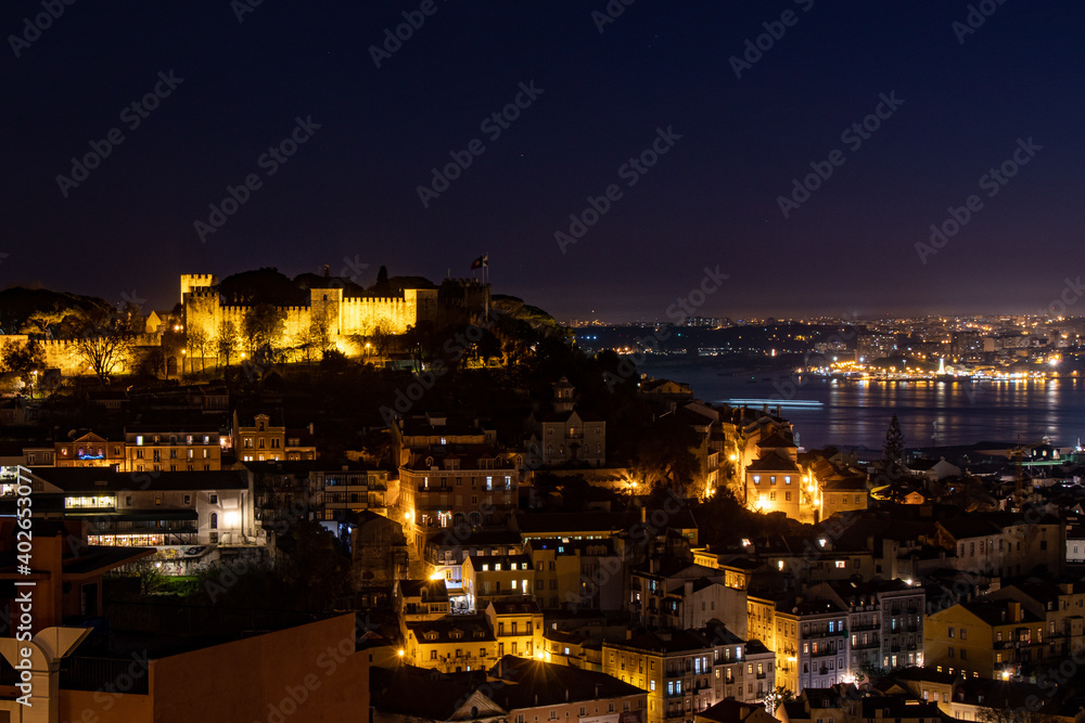 Lisbon, Portugal at night. Winter solstice 2020. View of Sao Jorge castle