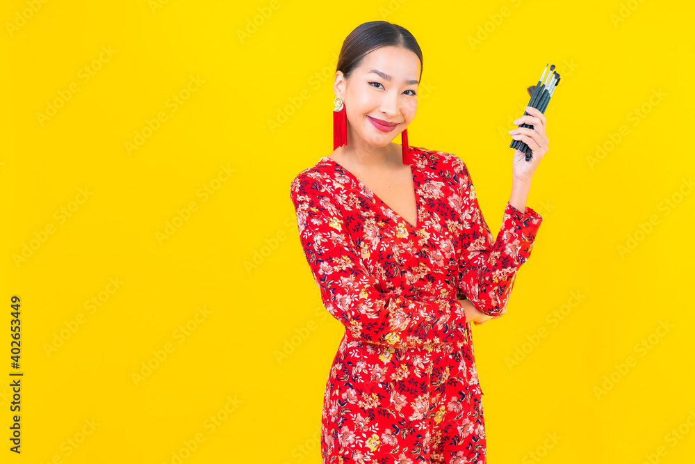 Portrait beautiful young asian woman with make up brush Portrait beautiful young asian woman with make up brush