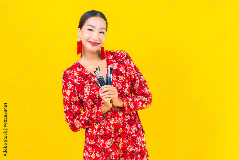 Portrait beautiful young asian woman with make up brush Portrait beautiful young asian woman with make up brush