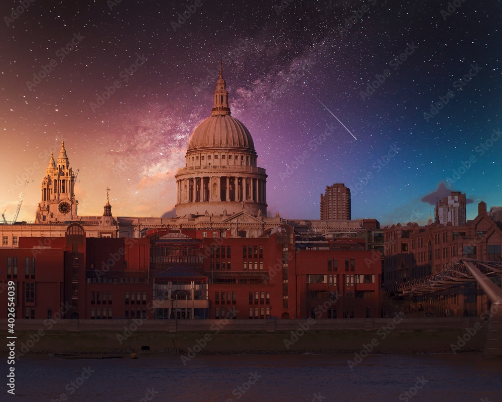 St Paul's cathedral and Millennium Bridge under starry night sky, London UK