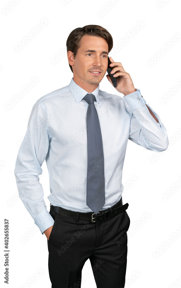 Businessman in shirt and tie talking on the phone, isolated over white background. Caucasian manager standing with phone, hand in the pocket Businessman in shirt and tie talking on the phone, isolated over white background. Caucasian manager standing with phone, hand in the pocket