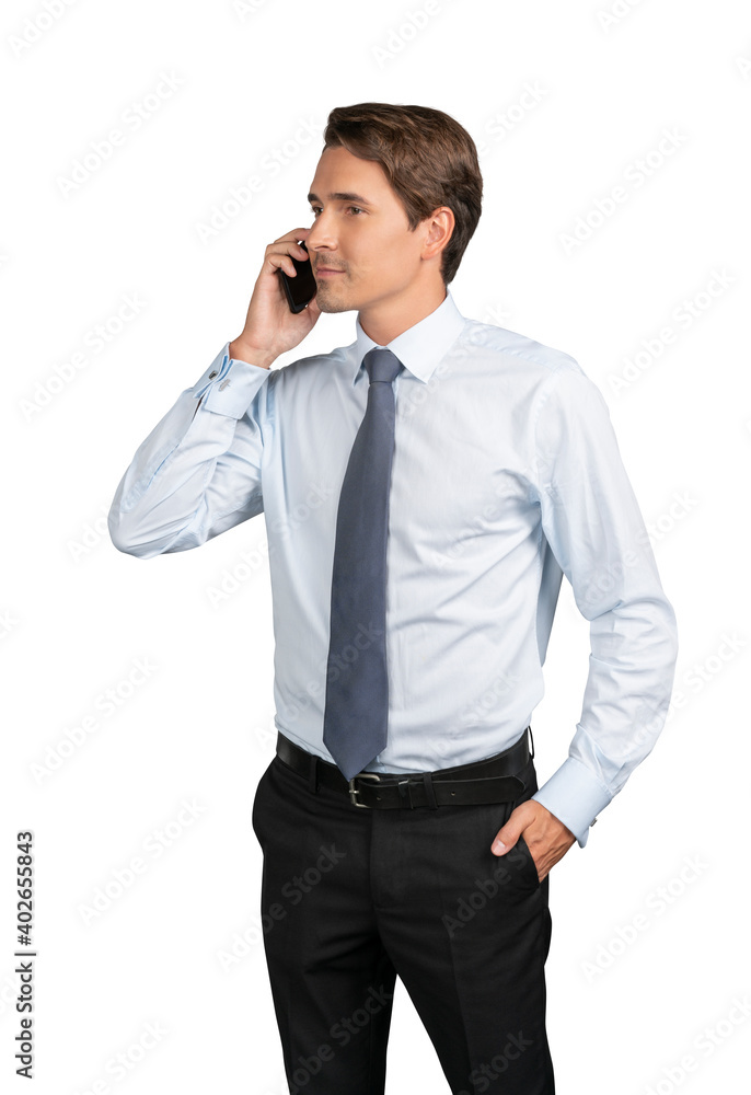 Businessman in shirt and tie talking on the phone, isolated over white background. Caucasian manager standing with phone, hand in the pocket Businessman in shirt and tie talking on the phone, isolated over white background. Caucasian manager standing with phone, hand in the pocket