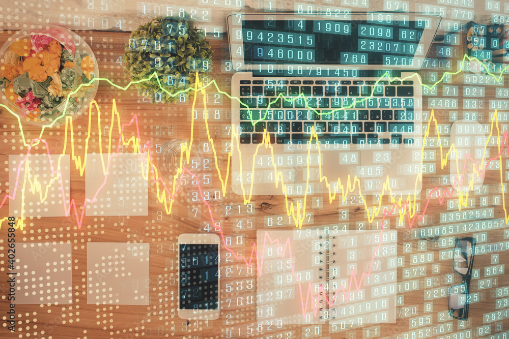Stock market graph and top view computer on the table background. Multi exposure. Concept of financial education. Stock market graph and top view computer on the table background. Multi exposure. Concept of financial education.
