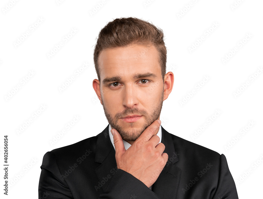 Young businessman in suit, closeup portrait shot of caucasian office manager. Serious handsome guy, hand to chin, in black jacket, isolated over white background Young businessman in suit, closeup portrait shot of caucasian office manager. Serious handsome guy, hand to chin, in black jacket, isolated over white background