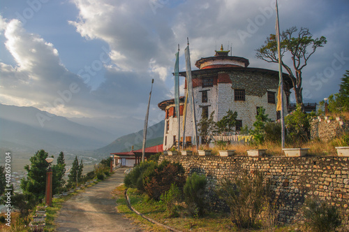 Beautiful sunset landscape view of  landmark ancient traditional watchtower Ta Dzong overlooking Paro valley in Western Bhutan