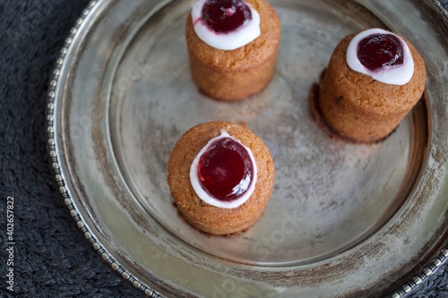 Three tasty Runeberg tartlets on silver plate