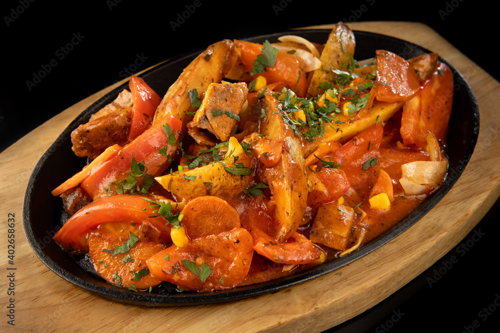 frying pan of grilled meat with vegetables frying pan of grilled meat with vegetables