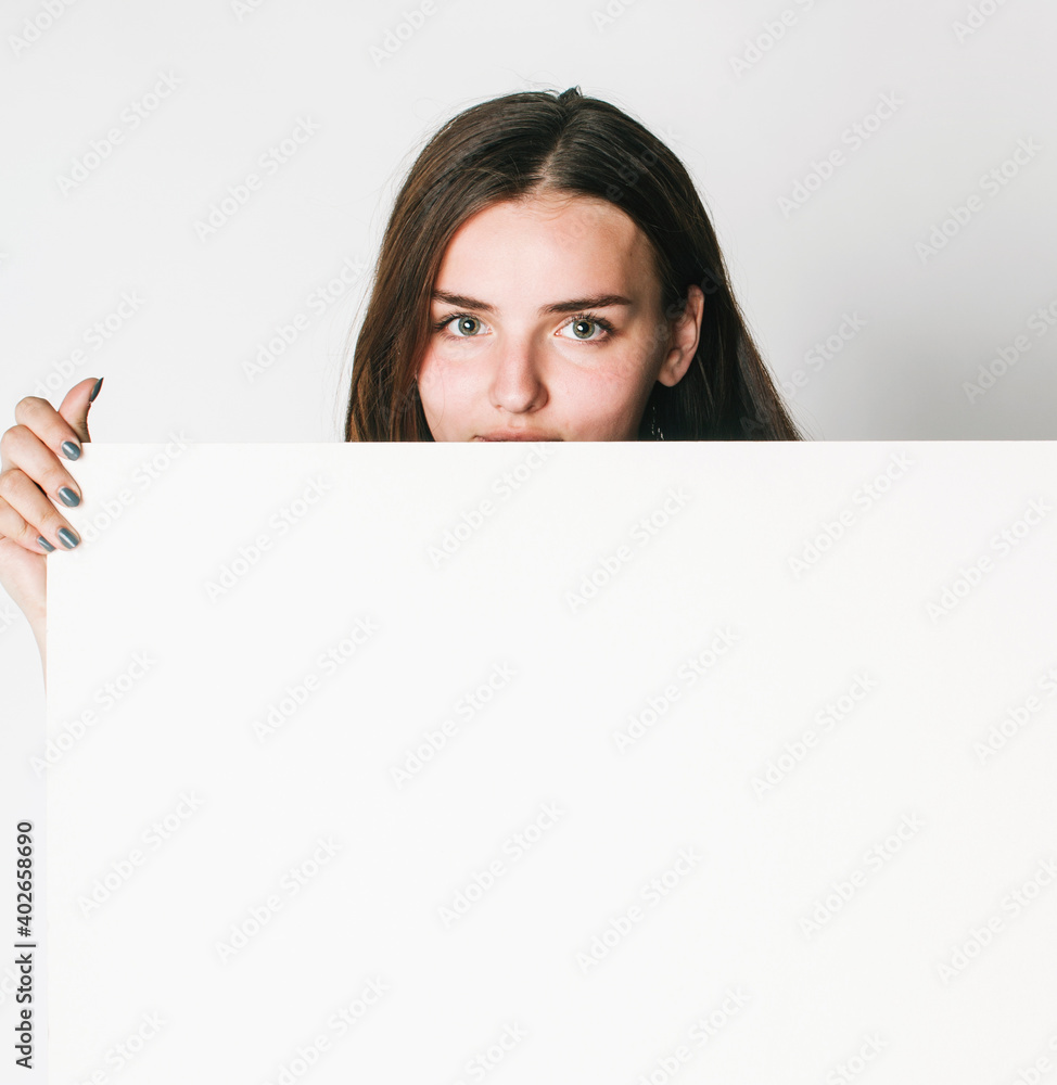 young pretty brunette girl with placard shit copyspace on white background wearing business costume student young pretty brunette girl with placard shit copyspace on white background wearing business costume student