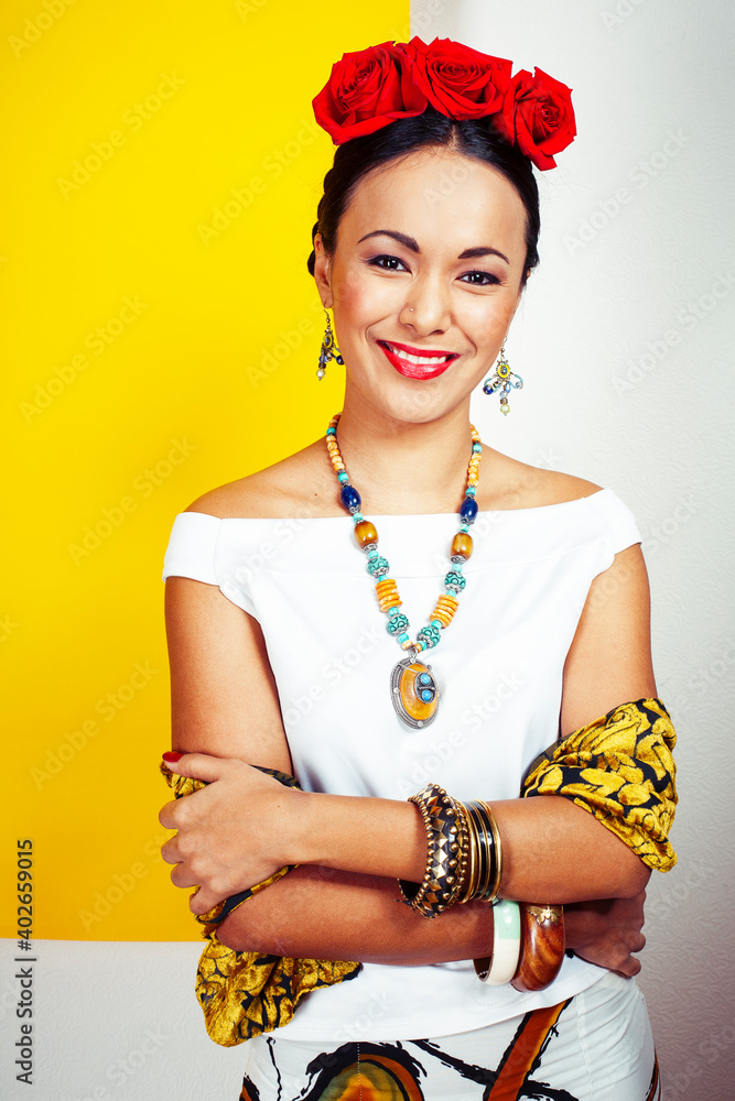 Obraz premium young pretty mexican woman smiling happy on yellow background, lifestyle people concept
