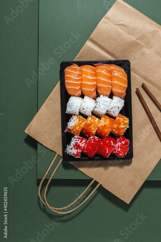 Japanese food concept to go. Sushi take away assortment photo