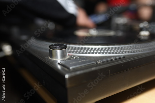 close up of a dj playing a record