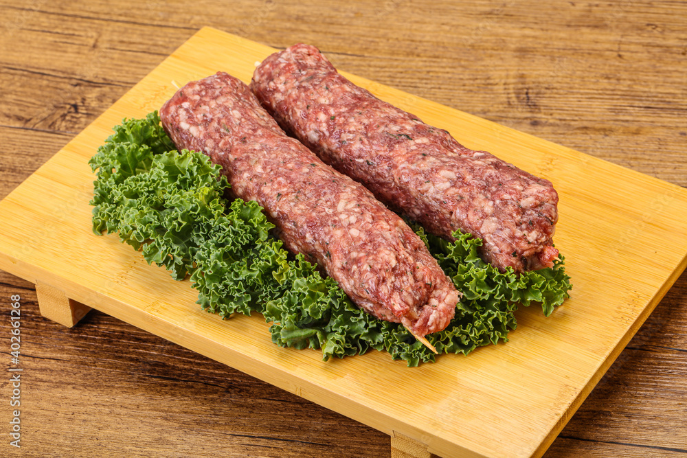 Raw minced beef kebab skewer