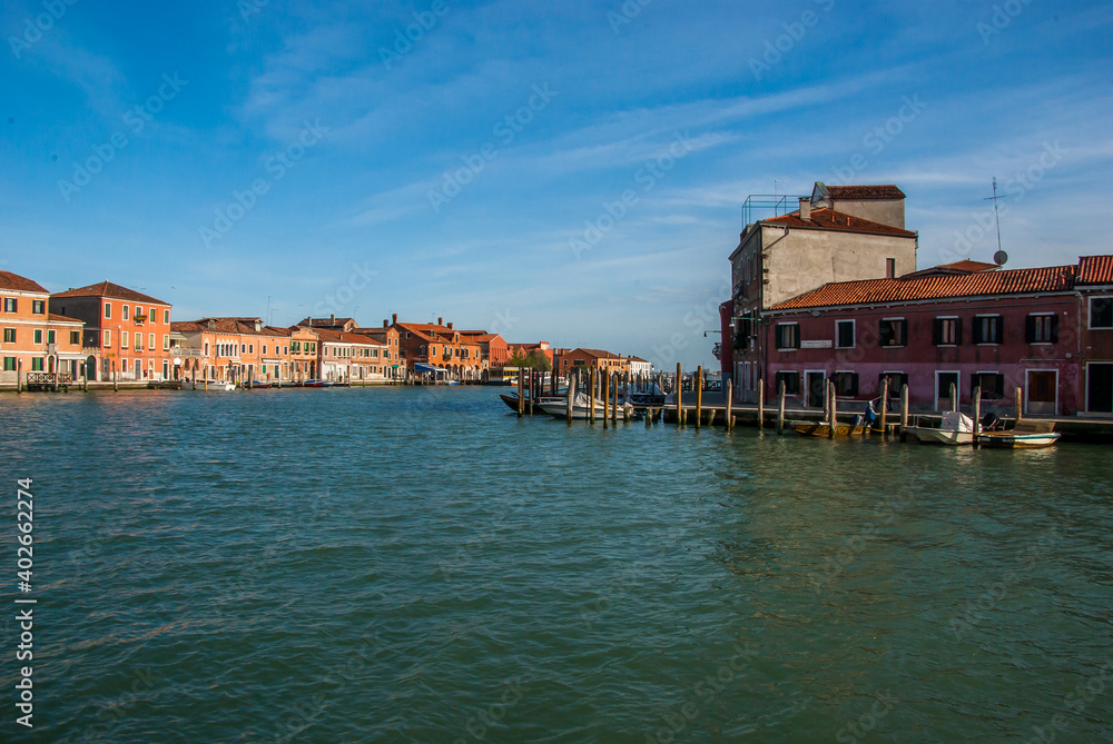 View of beautiful Murano, Italy, with water surface in the foreground. High quality photo