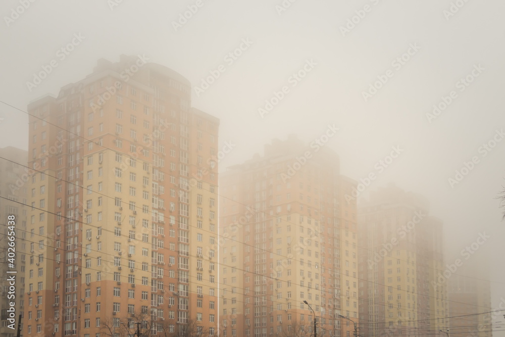 High-rise residential buildings in the fog. City in fog. Kyiv High-rise residential buildings in the fog. City in fog. Kyiv