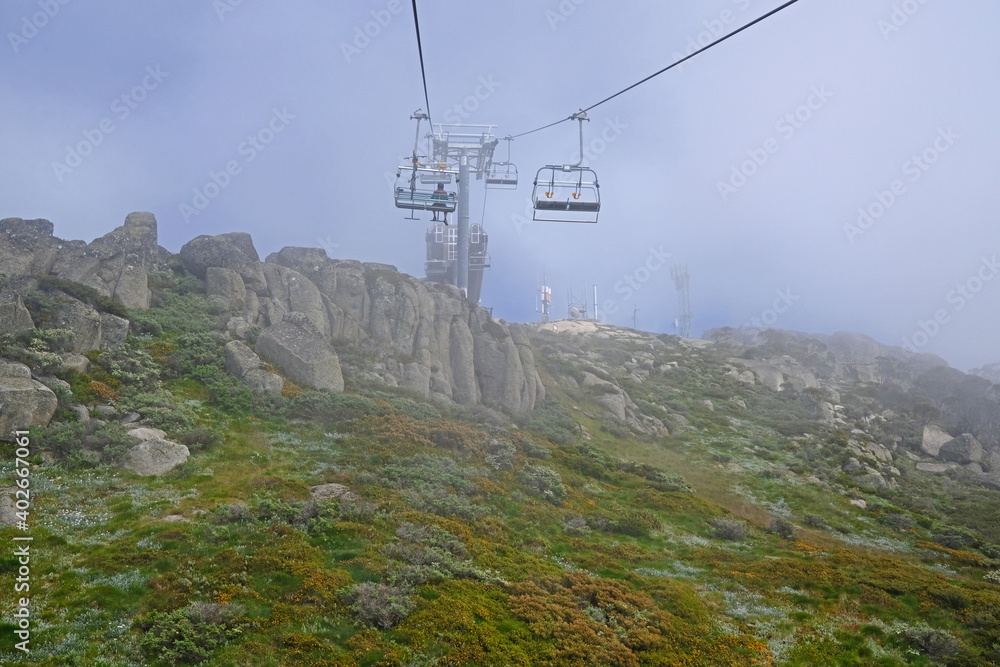 Thredbo chairlift in a misty summer morning - NSW Australia Thredbo chairlift in a misty summer morning - NSW Australia