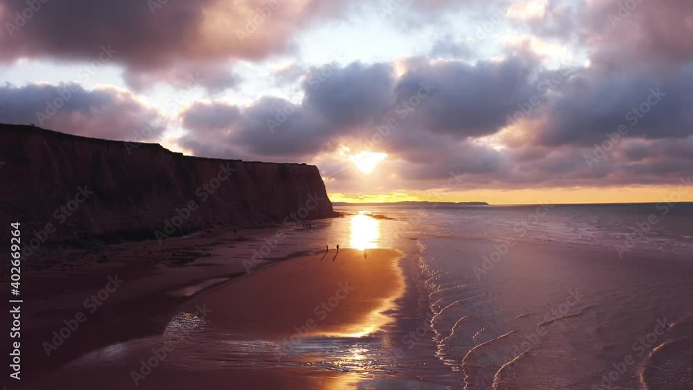Aerial view of cliff and beach at sunset Aerial view of cliff and beach at sunset