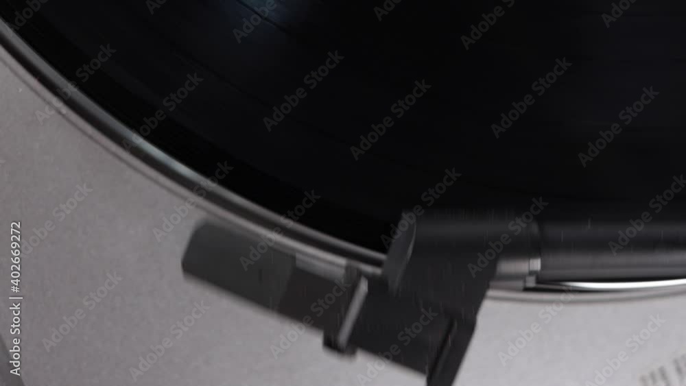 Close - Up Of A Needle Over A Rotating Vinyl Record On A Retro Style Close - Up Of A Needle Over A Rotating Vinyl Record On A Retro Style