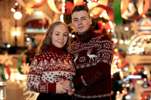 Christmas Love Story, Young Couple celebrating Christmas and New Year. 