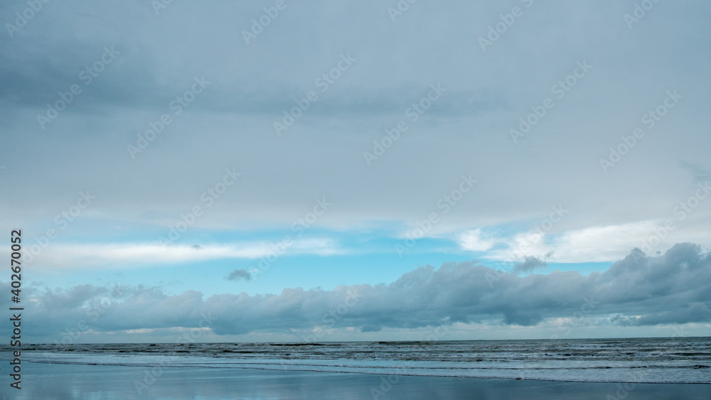 Seashore and blue sky in Normandie, winter