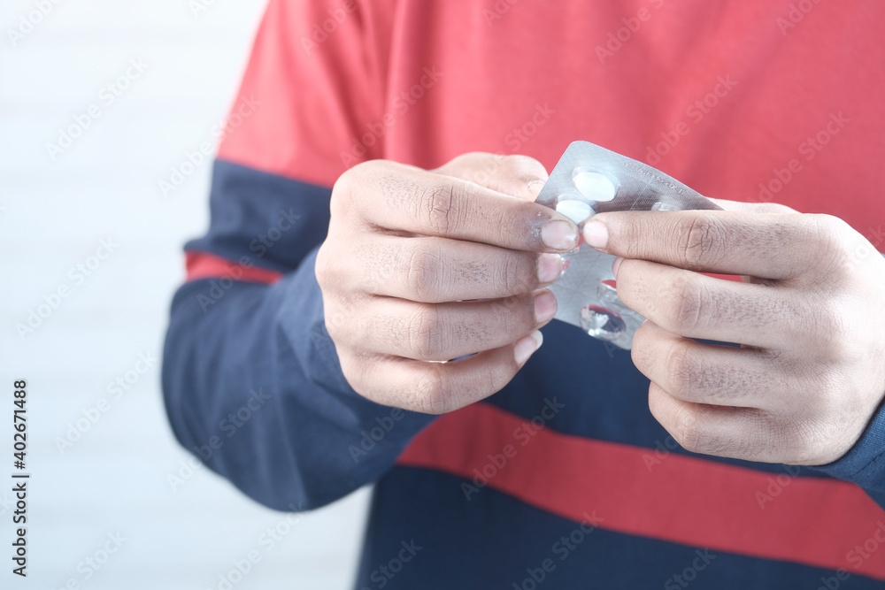 Fototapeta premium Close up of hand holding blister packs .